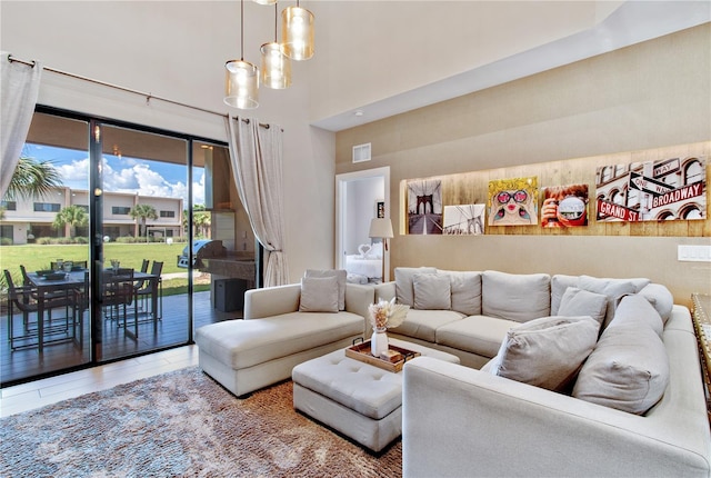 7461 Bleecker Ln, Kissimmee, FL 34747 - living area with wood finished floors and a towering ceiling