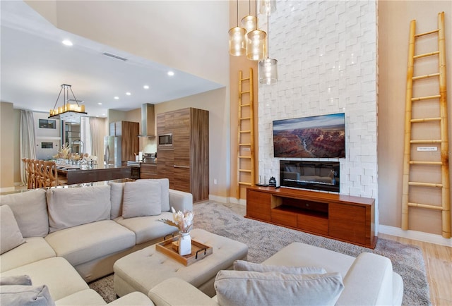 7461 Bleecker Ln, Kissimmee, FL 34747 - living area featuring recessed lighting, built in shelves, and a fireplace
