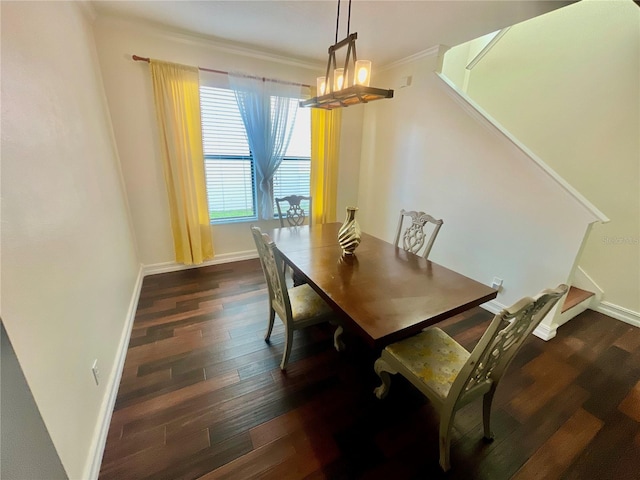312 Partridge Pea Ln, Ocoee, FL 34761 - dining space featuring dark wood-style flooring, ornamental molding, and a chandelier
