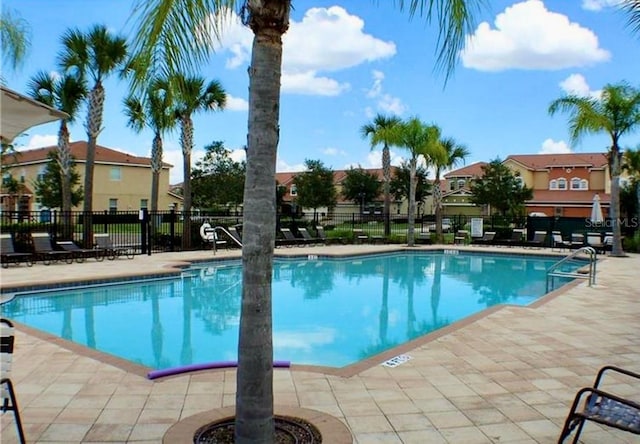 312 Partridge Pea Ln, Ocoee, FL 34761 - community pool with a patio