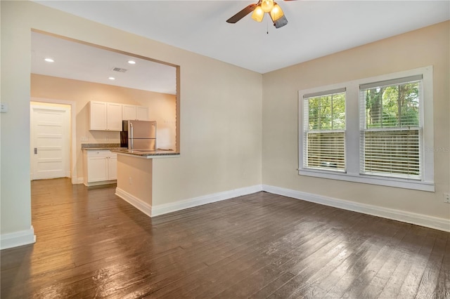 1201 S Myrtle Ave, Sanford, FL 32771 - unfurnished living room featuring dark wood-style flooring, a ceiling fan, and recessed lighting