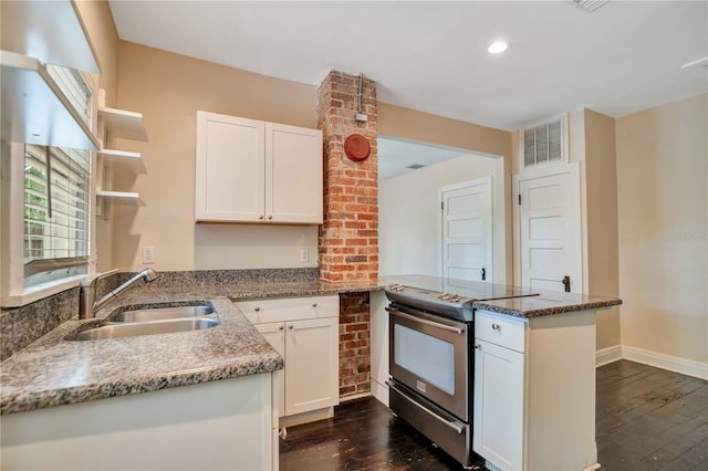 1201 S Myrtle Ave, Sanford, FL 32771 - kitchen featuring stainless steel electric range, a peninsula, open shelves, dark wood-style flooring, and white cabinetry