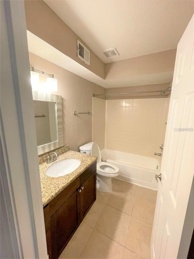 5116 Conroy Rd Unit 411, Orlando, FL 32811 - full bathroom featuring toilet, vanity, washtub / shower combination, and tile patterned floors
