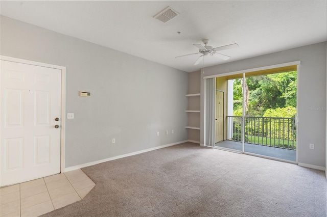 1400 Lake Shadow Cir Unit 10104, Maitland, FL 32751 - spare room with carpet flooring, ceiling fan, and tile patterned flooring