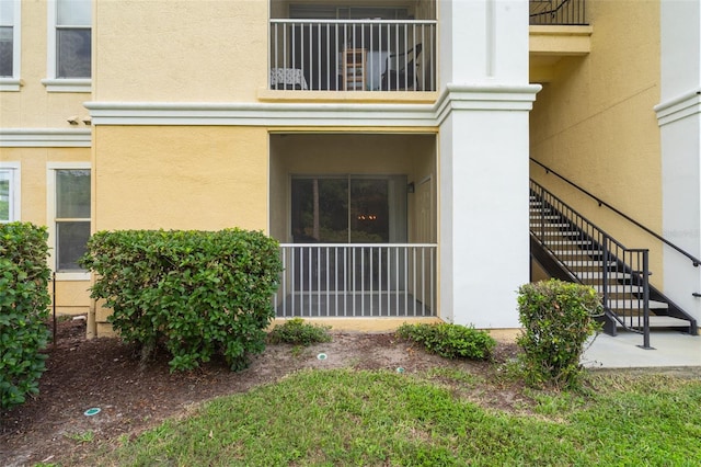1400 Lake Shadow Cir Unit 10104, Maitland, FL 32751 - view of side of home with stairs, stucco siding, and a balcony