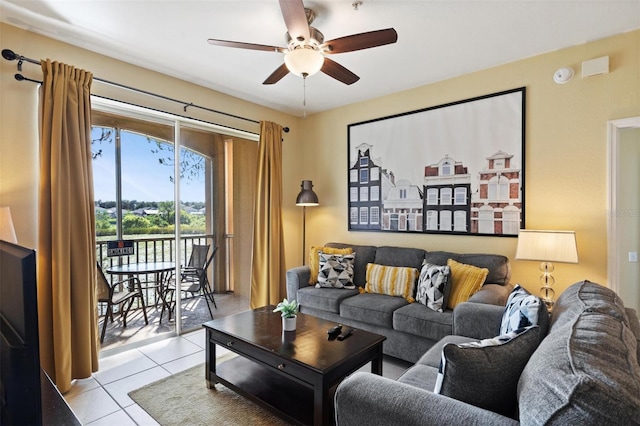7660 Comrow St Unit 203, Kissimmee, FL 34747 - living area featuring light tile patterned floors and a ceiling fan