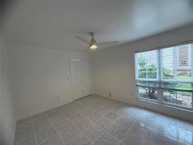 4674 Pembrook Pl Unit J 101, Orlando, FL 32811 - unfurnished room with ceiling fan and light tile patterned floors