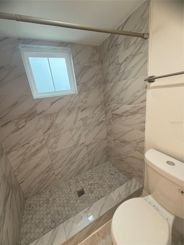 4674 Pembrook Pl Unit J 101, Orlando, FL 32811 - full bathroom featuring a shower stall and toilet