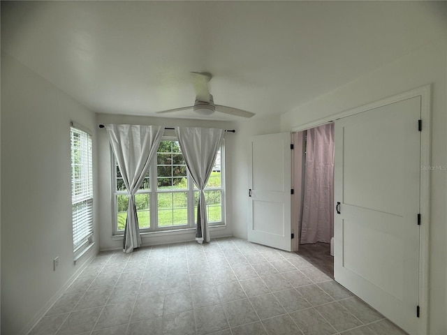 4674 Pembrook Pl Unit J 101, Orlando, FL 32811 - empty room featuring ceiling fan and tile patterned flooring