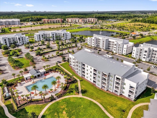 3180 Paradox Cir Unit 304, Kissimmee, FL 34746 - bird's eye view of apartment complex, a large body of water, and a pool area