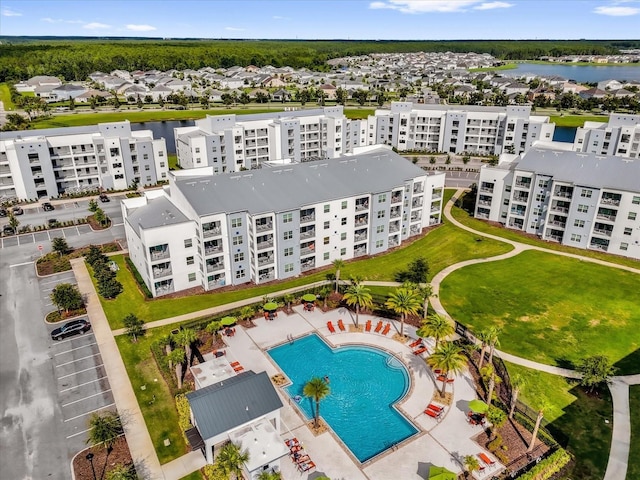3180 Paradox Cir Unit 304, Kissimmee, FL 34746 - bird's eye view of apartment complex / building, a pool, and a large body of water