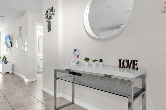 3180 Paradox Cir Unit 304, Kissimmee, FL 34746 - dining space with light tile patterned floors and baseboards