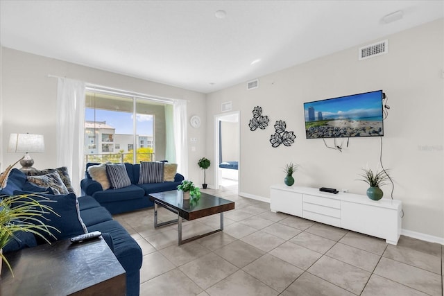3180 Paradox Cir Unit 304, Kissimmee, FL 34746 - living area featuring light tile patterned floors and baseboards