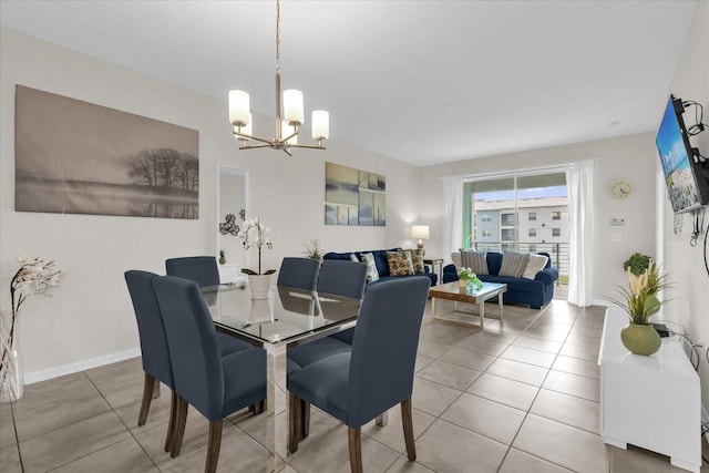 3180 Paradox Cir Unit 304, Kissimmee, FL 34746 - tiled dining area with a chandelier and baseboards