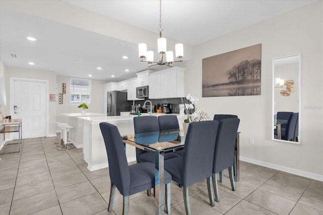 3180 Paradox Cir Unit 304, Kissimmee, FL 34746 - dining area featuring a chandelier, recessed lighting, and light tile patterned floors