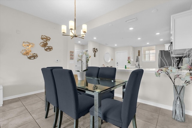 3180 Paradox Cir Unit 304, Kissimmee, FL 34746 - dining room featuring a chandelier, light tile patterned floors, recessed lighting, and baseboards
