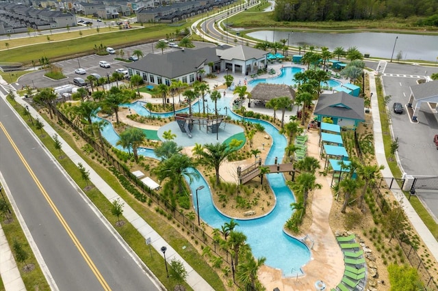 3180 Paradox Cir Unit 304, Kissimmee, FL 34746 - bird's eye view of a pool and a nearby body of water
