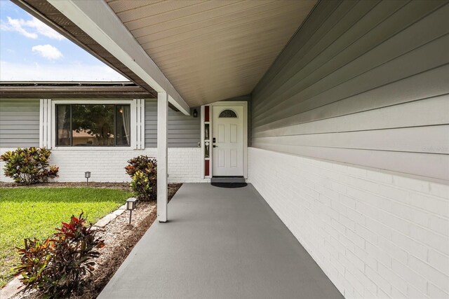 930 Chickadee Dr, Port Orange, FL 32127 - property entrance featuring a yard