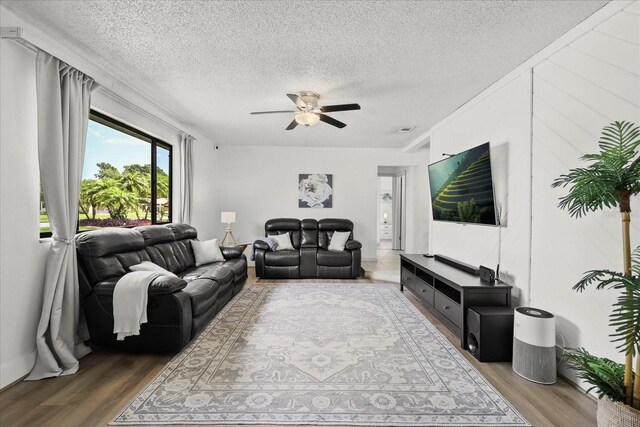 930 Chickadee Dr, Port Orange, FL 32127 - living room with wood finished floors, a textured ceiling, and ceiling fan