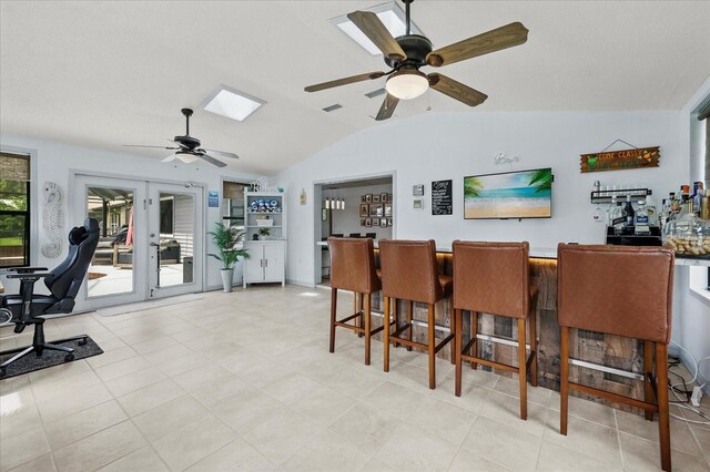 930 Chickadee Dr, Port Orange, FL 32127 - dining room with a ceiling fan, vaulted ceiling, a bar, and an office area