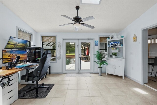 930 Chickadee Dr, Port Orange, FL 32127 - office area featuring french doors, a textured ceiling, a ceiling fan, light tile patterned floors, and baseboards