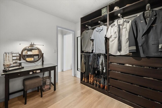 930 Chickadee Dr, Port Orange, FL 32127 - walk in closet with wood finished floors