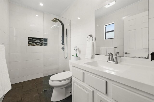 930 Chickadee Dr, Port Orange, FL 32127 - full bathroom featuring ornamental molding, tile walls, tiled shower, vanity, and toilet