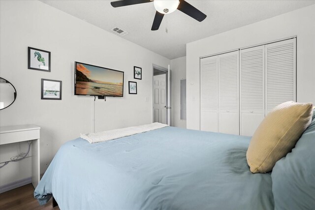 930 Chickadee Dr, Port Orange, FL 32127 - bedroom with dark wood finished floors, a closet, ceiling fan, and baseboards