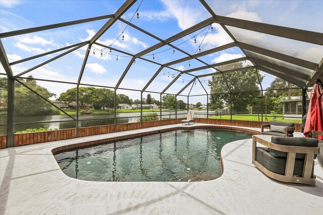 930 Chickadee Dr, Port Orange, FL 32127 - swimming pool with a water view, a patio, and a lanai