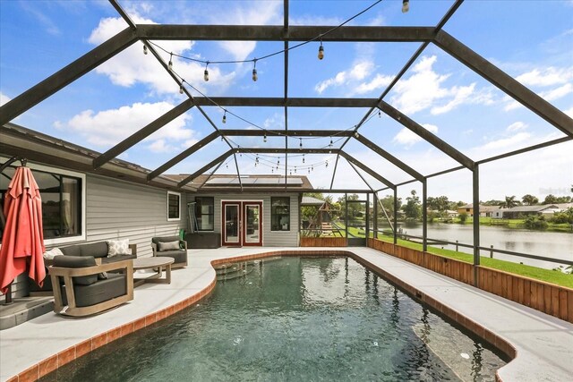 930 Chickadee Dr, Port Orange, FL 32127 - outdoor pool with french doors, a water view, a patio area, and a lanai