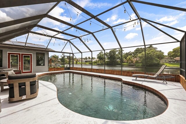 930 Chickadee Dr, Port Orange, FL 32127 - swimming pool with a water view, a patio, and a lanai