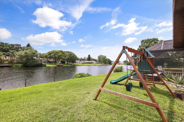 930 Chickadee Dr, Port Orange, FL 32127 - view of green lawn featuring a playground and a water view