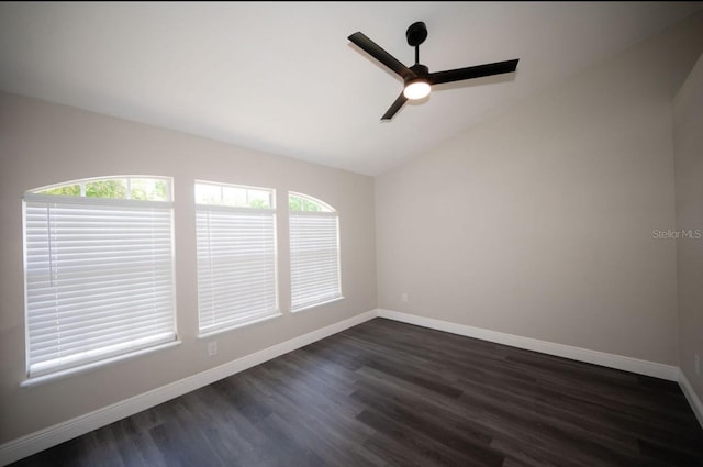 5118 Log Wagon Rd, Ocoee, FL 34761 - spare room with a ceiling fan, vaulted ceiling, dark wood finished floors, and baseboards