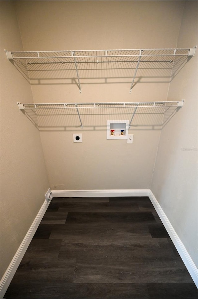 5118 Log Wagon Rd, Ocoee, FL 34761 - washroom featuring electric dryer hookup, baseboards, dark wood finished floors, and washer hookup