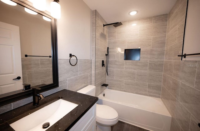 5118 Log Wagon Rd, Ocoee, FL 34761 - full bathroom featuring tile walls, toilet, vanity, shower / tub combination, and recessed lighting