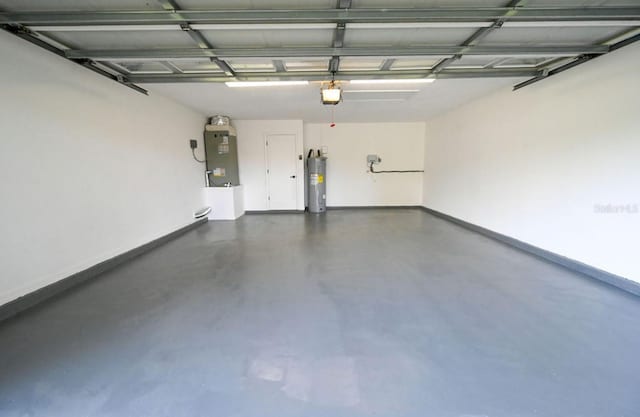 5118 Log Wagon Rd, Ocoee, FL 34761 - garage featuring water heater, a garage door opener, and baseboards