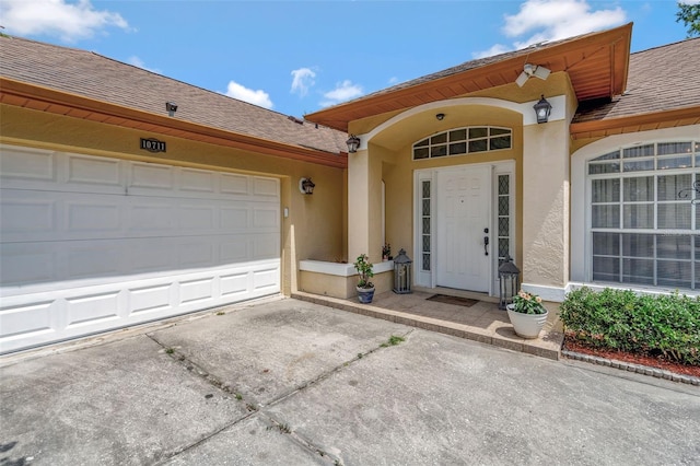 10711 Lake Hill Dr, Clermont, FL 34711 - entrance to property with roof with shingles, stucco siding, and driveway