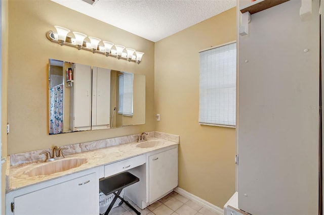 10711 Lake Hill Dr, Clermont, FL 34711 - full bathroom with double vanity, tile patterned flooring, a textured ceiling, and curtained shower