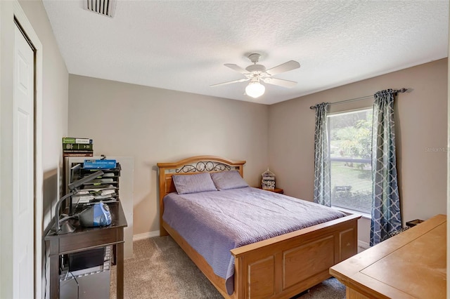 10711 Lake Hill Dr, Clermont, FL 34711 - carpeted bedroom with ceiling fan and a textured ceiling