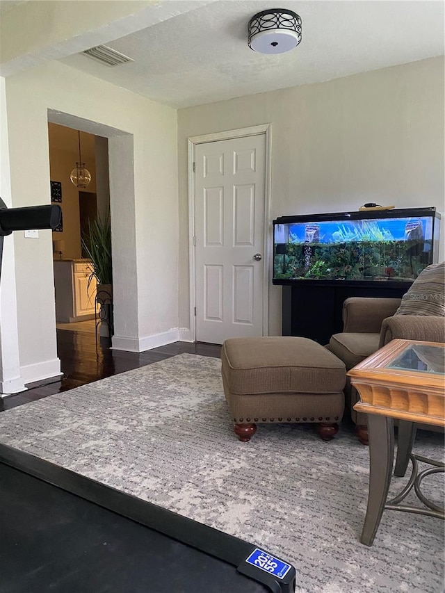 10711 Lake Hill Dr, Clermont, FL 34711 - living area featuring baseboards and wood finished floors