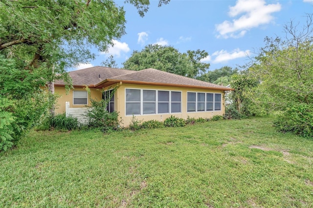 10711 Lake Hill Dr, Clermont, FL 34711 - view of home's exterior with stucco siding and a lawn