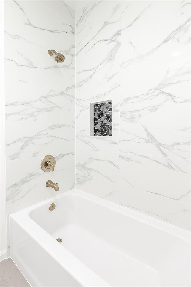 313 Bass Ct, Kissimmee, FL 34759 - bathroom with bathing tub / shower combination