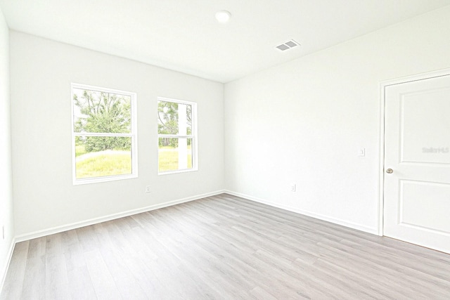 313 Bass Ct, Kissimmee, FL 34759 - spare room with wood finished floors and baseboards
