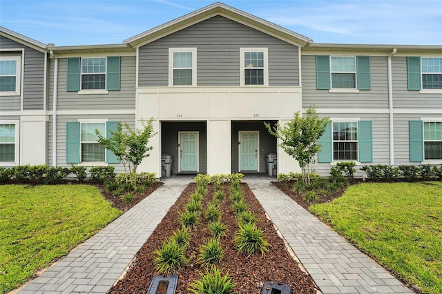 720 Gardenia Ln, Davenport, FL 33897 - townhome / multi-family property featuring a front yard