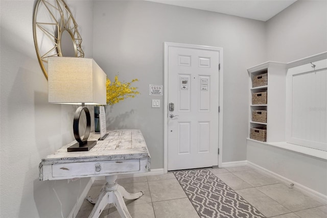 720 Gardenia Ln, Davenport, FL 33897 - mudroom featuring light tile patterned floors and baseboards