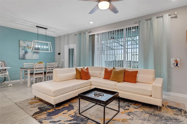 720 Gardenia Ln, Davenport, FL 33897 - living room featuring a ceiling fan, tile patterned floors, recessed lighting, and a chandelier