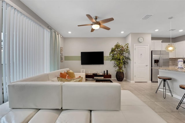 720 Gardenia Ln, Davenport, FL 33897 - living room featuring a ceiling fan, light tile patterned flooring, and recessed lighting