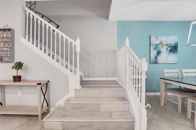 720 Gardenia Ln, Davenport, FL 33897 - stairway with baseboards and tile patterned floors