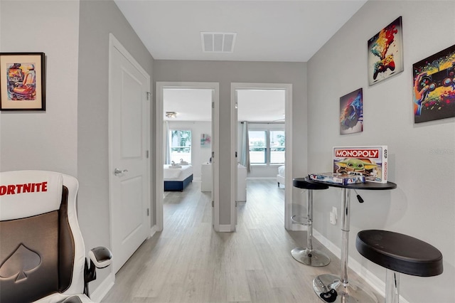 720 Gardenia Ln, Davenport, FL 33897 - hall featuring light wood-type flooring and baseboards
