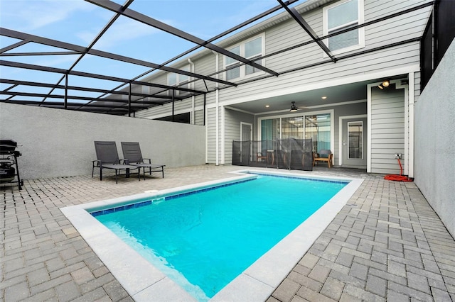 720 Gardenia Ln, Davenport, FL 33897 - swimming pool with a patio, ceiling fan, and glass enclosure